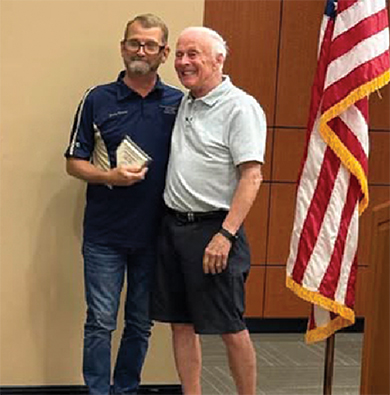 Jimmy Sherman, left, accepts award from Eddie Holbrook.