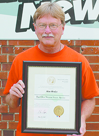 Banner-News Editor Alan Hodge is pictured with the Old North State Award presented by Governor Roy Cooper May 10, 2017.