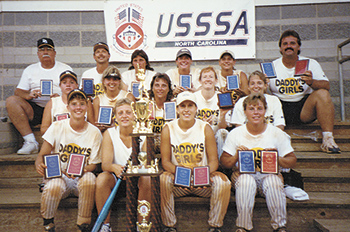 Champion, with members of one of his "Daddy\'s Girls" teams. 