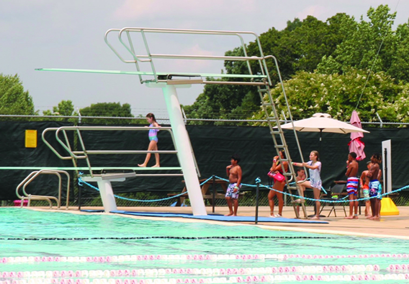 This little lady wasn't quite ready for the high dive yet so she ventured out onto the smaller dive platform at July's STAR Camp swim and cookout day at the Shelby City Park pool