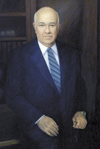 A portrait of the late C.L. Fox, who founded Fox Distributing in 1980, hangs in the stairway of the business. Foxâ€™s son, Larry Fox, succeeded his father as president and CEO.