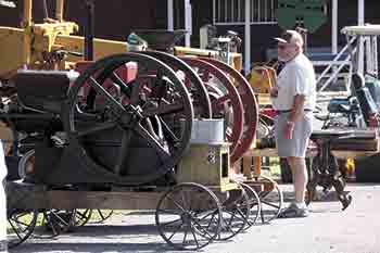Bill Herndon of Fallston looks over the two engines he brought to the 3rd Annual Threshers Reunion.