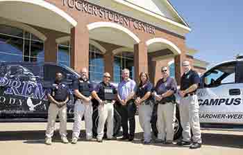 Frank Stewart, owner of Premier Body Armor of Kings Mountain, N.C., is pictured center with Gardner-Webb University Police officers. Photo by Mark Houser/GWU