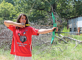 Gabriel Muscat, 17, gets set to let an arrow fly. Muscat is having great success as a competitive archer.