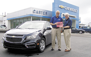 Checking out this year's prize -- 2015 Chevy Cruz valued at over $21,000 -- are Mark Carter, Carter Chevrolet and Jack Weller, Boys & Girls Club.  