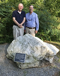 John Connor, left, and Clyde Kerns with the new monument stone.