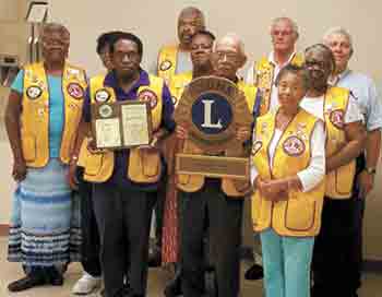 Back row left to right: Lawndale Lions Secretary Sharon Martin, Willen Griffin, Vice President Donald Schenck, Deborah Williams, Zone Chair Larry Vosburgh, Treasurer John Laughlin, and Bernice Hector. Front row: President Henry Griffin, Robert Hector and 