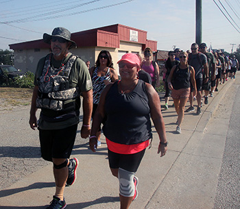 Jake Gales Manager of VFW POST 4066 in Shelby and his wife Peggy, front, took part in the March.