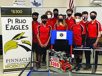 Pinnacle Classical Academy's grade 7-12 robotics team, the Pi Rho Eagles, are (L-R): Daniel Briceno, David Briceno, Ben Caunt, Jayden Robbs, Chesnee Stewart, Robert Stockham, Aiden Leon, Matthew Morehead, and Owen Slagle. (Missing from photo - Casey Green