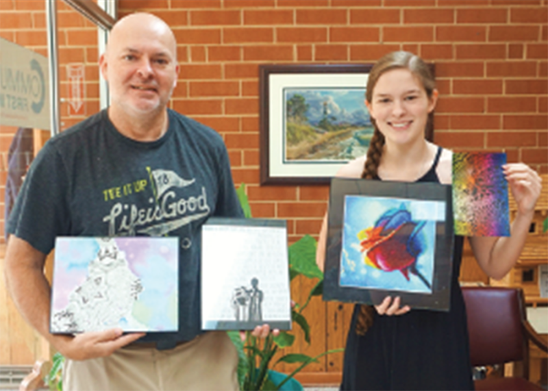 Allie MacArthur and her Dad Noel with some her art she is wanting to sell to raise money for The Neal Center.