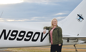 Caitlin Cobb, 17, stands beside the plane she trained and soloed in, a Cessna Skyhawk 172. (photos provided)