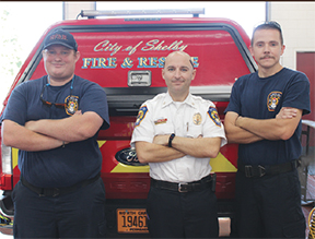 Shelby Fire Department Battalion Chief Quentin Cash at the fire station taking a few minutes to get this photo for the Shopper. With him are firefighters Zack Kale (left) and Engineer Adam Kates (right).