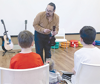 Justin Harper teaches a music class at the Earl Scruggs Center in Shelby in 2019. Harper has teamed up with the ESC to offer "Musical Explorations" classes throughout 2021.