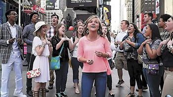 Members of the Crest High School a cappella group, Tonal Spectrum, perform in New York City's Times Square during the group's trip to the city to compete in the  Varsity Vocals International Championship for High School A Cappella in April. Tonal Spectrum