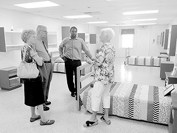Pictured left to right: Joyce and Oland Summers, Pastor Michael Gullatte, CCRM Executive Director, and Nancy Freeman, CCRM Board member, tour Heart 2 Heart Place during the open house.