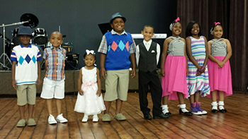Contestants line the stage in the 2016 Little Miss and Little Mister pageant.