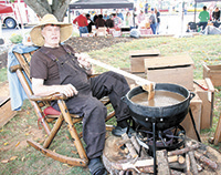 Rob Jackson sits back while making a big kettle of Apple Butter. Over 1000 jars of the tasty sauce was available for sale at the fundraiser.