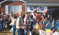 Gentlemen from the Masterâ€™s House received a years supply  of goods that were gathered and donated by the scouts.