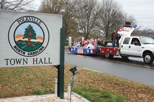 Frosty The Snowman leads a packed "Little Hands Of Love" preschool  float. All the kids and teachers were snuggled together to keep warm and candy was flying all over the parade route! 