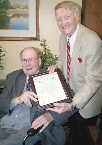 Chairman, Hoyt Bailey (right) presents Dr. Gene Yarboro the Long Leaf Pine award.