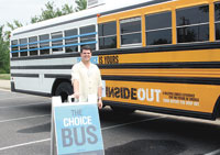 Executive Director, Phil Christian of the  Mattie C. Stewart  Foundation next to the "Choice Bus".