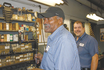 Gene Mintz (left) helps out the main man, Steve Willis, in the back workshop.  Jason Hovis (not shown) also assists Steve.