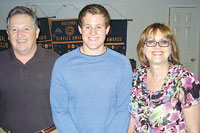 Alan Bridges (center) pictured with his Mom and Dad, Curt and Grace Bridges.