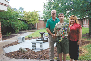 Justin Lattimore with his parents,  John and Valerie.