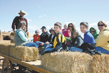 Enjoying a fun ride around the Elliott Farms during the Heritage Days (l to r): Loretta Newton, Brad Saunders, Emma and Dennis Greene, Mary McNeilly, Zachary Saunders, Lala, Lisa and Anna Donaldson, Jacob Saunders and Lawson and Lee Rudisill. 