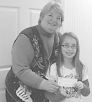 Keely Bryant presents $400 check to Margie Christopher, Executive Director CHCC.