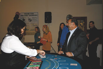 Larry Dooley of Fox Distributing was all smiles after winning a hand of Blackjack.