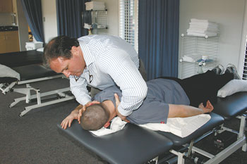 Don Miller doing a spinal adjustment.