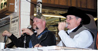Will Thompson and auctioneer Andy Elmore take in bids and finalize the sales.