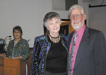President Kay Ward (at the podium) spoke at the presentation ceremony as the Presidentâ€™s Award was announced and given to Margaret and Ray Ledford.