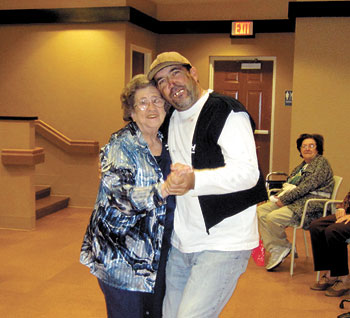 Vivian Jenkins welcomes an â€œErnest T. Bassâ€ character to Life Enrichment Center. His antics had everyone slapping their knees in laughter.