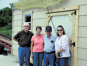 Cleveland County Beekeepers Association members (left to right), Doug Blanton, Kim Hamrick, Loyd Lewis and Annie Thompson welcome the new â€œHoney Houseâ€.