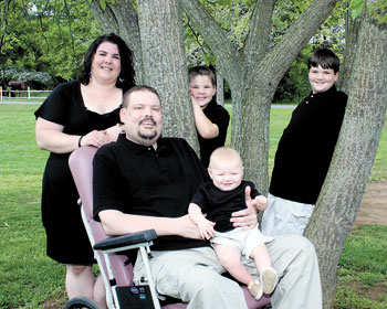 Jennifer and Robert Francis pictured with their three children.