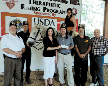 Pictured left to right: Max Brooks, Vice President; Floyd Williams; Sharon Gensch, North Shelby School Principal; Noel MacArthur, Piedmont Shrine President; Charles Grigg, Z.B. Hoppes, and Kristin Lafleur on the horse.