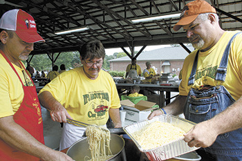 Volunteers Scott Redmon, Doug Pittman and Artie Hubbard kept the spaghetti coming at the special fundraiser.
