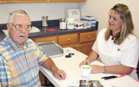 Don Smith receives a HBGA1C test, a 90 day reflection of blood sugar, by staff member Leslie Phillips, Lab Technician. 