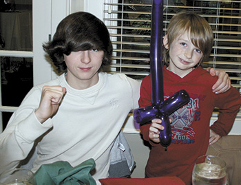Robbie (right) and his brother Garrett had a great time at the Kiwanis Christmas party. 