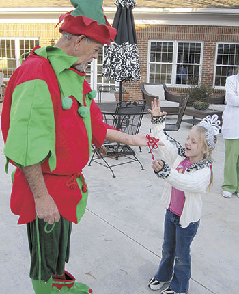 Vivian with Santaâ€™s Magic Elf
