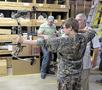 CTO member Parker Mims gets some pointers from  professional archery instructor Jim Vennera.