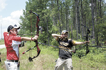 Competing in the young adult class are: Drew Trull, 14, of Monroe, NC and Jeffrey Johns, 13, of Statesville, NC take aim in their first  tournament. 