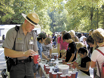  Ranger Lance Huss assists group in making plaster animal tracks. 