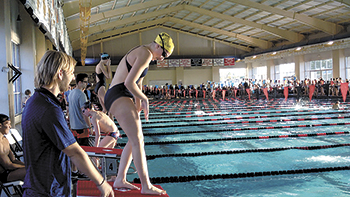 Coach Gray Tedder and Sharks swimmer Kaitlyn Moss.