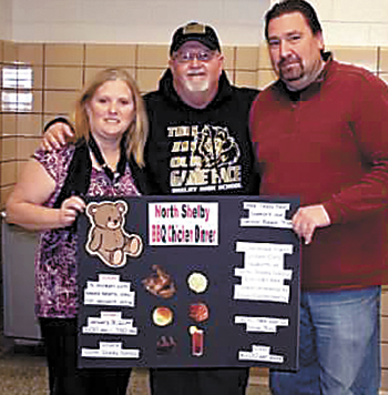 Carol Goforth, Carl Fortenberry a/ka Teddy Bear  and Kevin Roberts  make preparations.