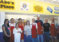 Volunteers at the Knights of Columbus, â€œAbeâ€™s Placeâ€,pictured left to right, are Karen Alvarec, Jose & Janette Cantera (with baby Jared), Fidelio Gonzalez, Nancy & Frank Kopenec, Bob Burkhardt, and Mary & Eric Stockham.