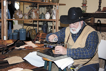 One of the craftsman at Woodmill was Gary D. Poovey from Vale. He was demonstrating how to make custom leather goods.