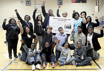 Current members of the Boys & Girls Club celebrate plans for the new Mable Hamrick Whisnant Teen Center with Millie Holbrook.